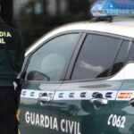 Agente y vehículo de la Guardia Civil. | Fuente: EP